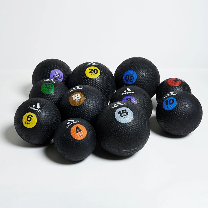 Aeromat Medicine Balls in 2, 4, 6, 8, 10, 12, 15, 18, 20, 25, 30 lbs shown together.