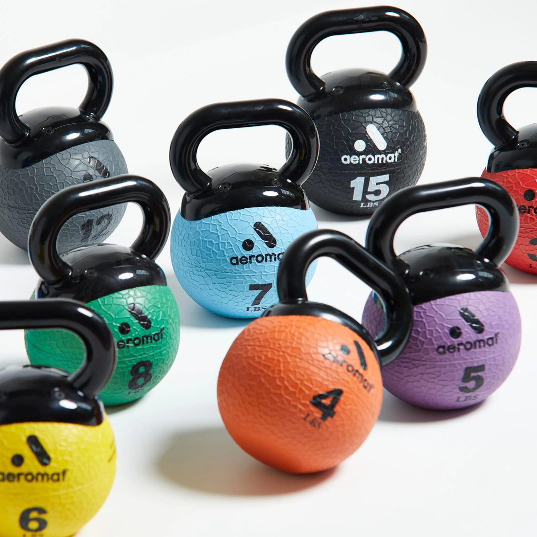 Aeromat Elite Mini Kettlebell Set in 3, 4, 5, 6, 7, 8, 10, 12, 15 lbs all shown together.