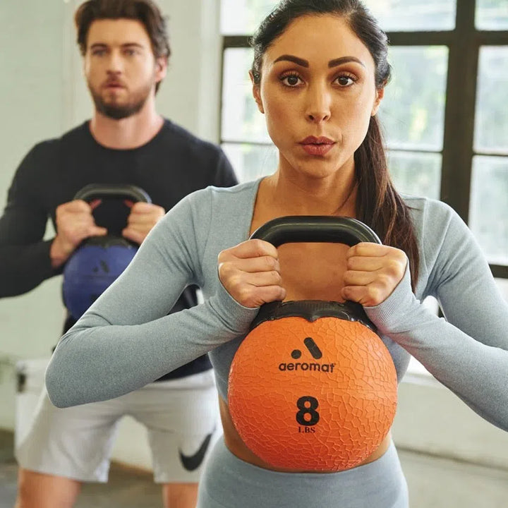 woman and man kettlebell workout