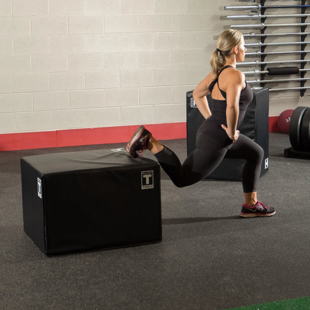 Woman doing lunges on the Body-Solid Soft Plyo Box BSTSPBOX