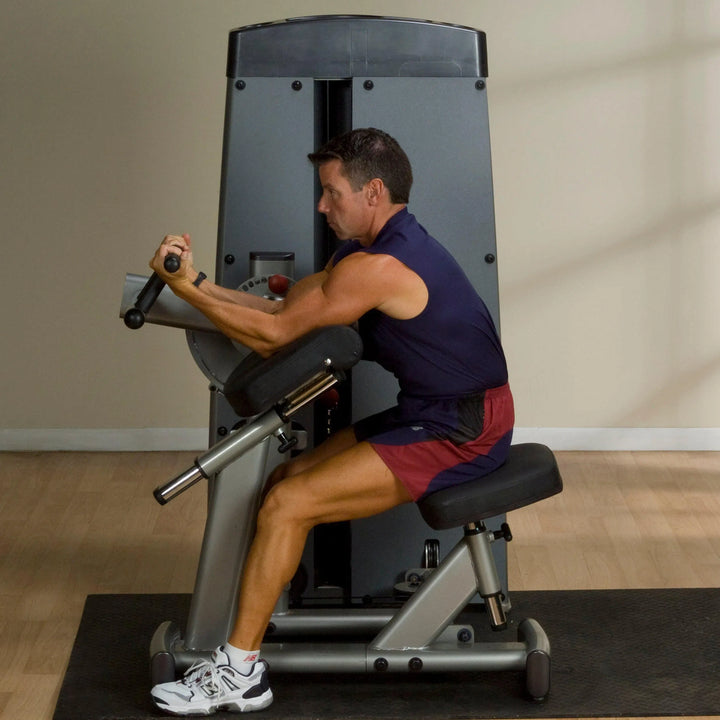 man bicep curl on the Body-Solid Bicep and Tricep Machine DBTCSF