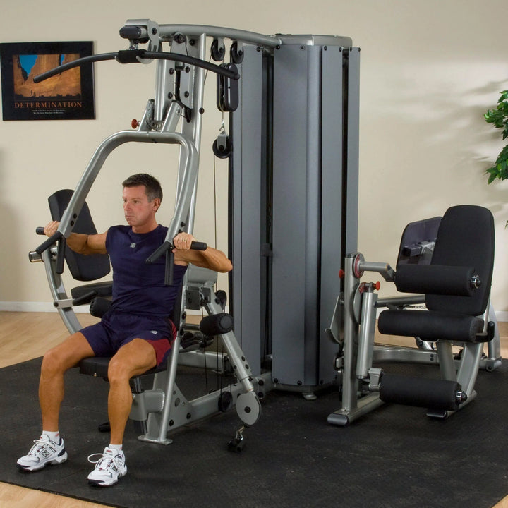 man chest press on Body-Solid Commercial Multi Station Gym DGYM