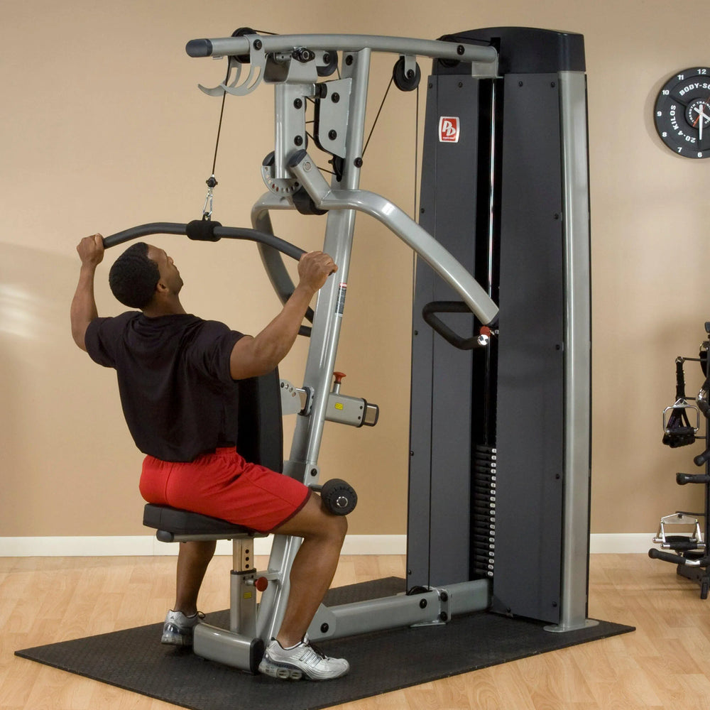 A man training on the Body-Solid Chest and Back Machine DPLSSF