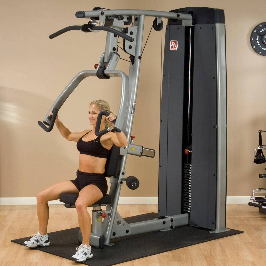 girl chest press on Body-Solid Chest and Back Machine DPLSSF