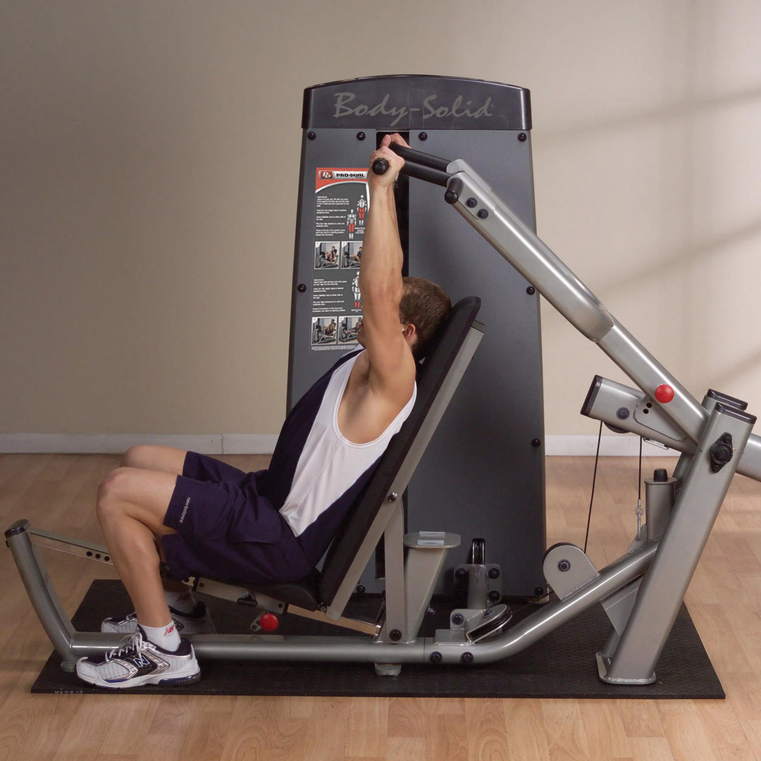 man doing shoulder press on the Body-Solid Multi-Press Machine DPRSSF