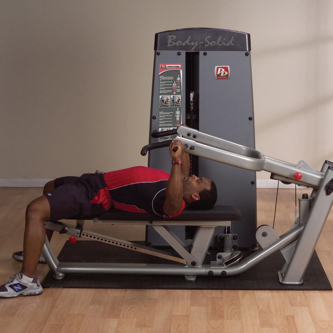 man flat bench chest press exercise on Body-Solid Multi-Press Machine DPRSSF