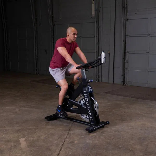 man workout on Body-Solid Endurance Studio Spin Bike ESB250