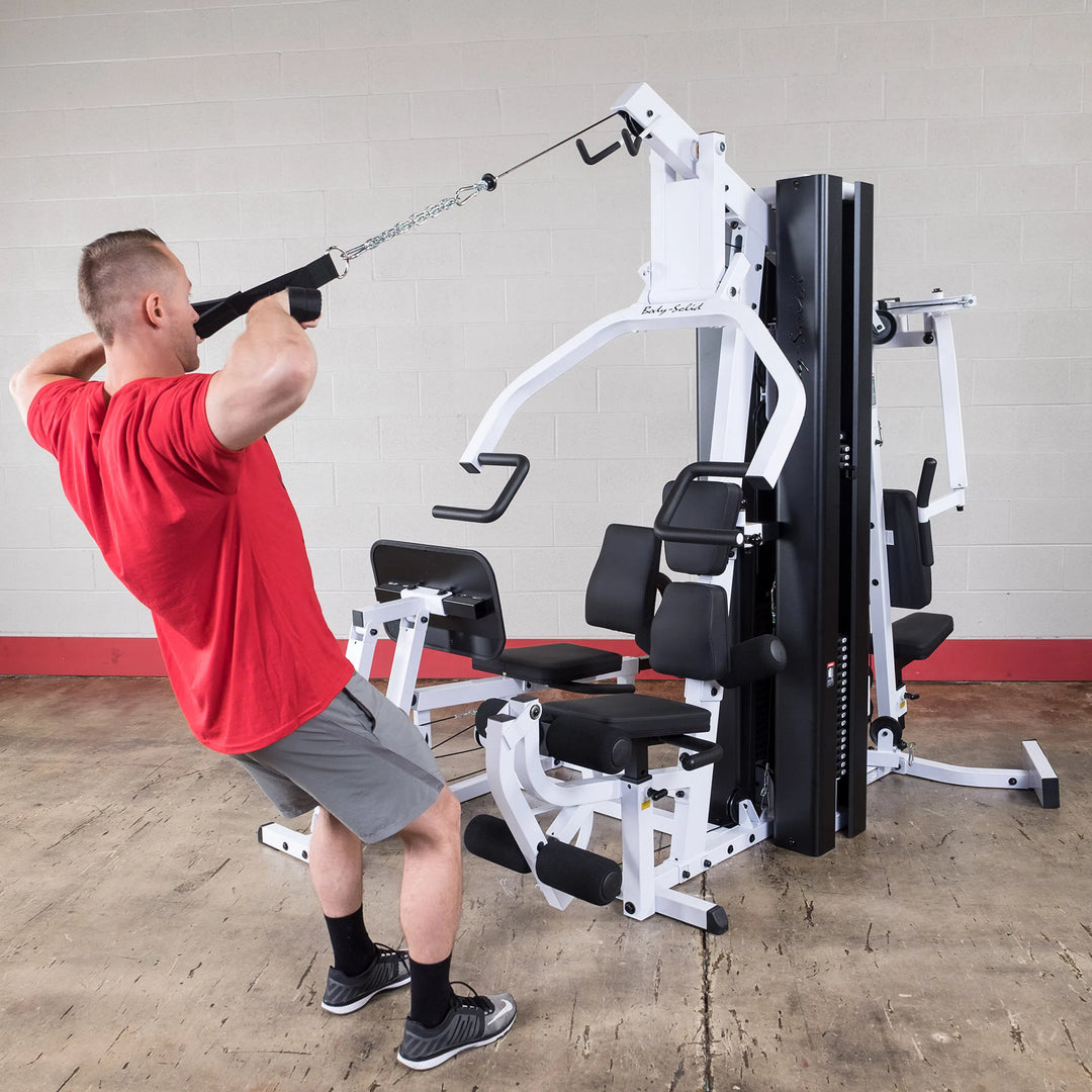 man high face pull exercise on Body-Solid Universal Weight Machine with Leg Press EXM3000LPS