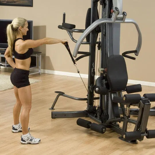A woman training on the Body-Solid Fusion Commercial Exercise Machine F500