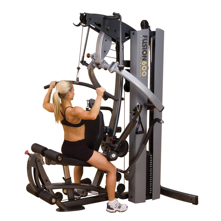 girl lat pull down workout on Body-Solid Fusion Commercial Exercise Machine F600
