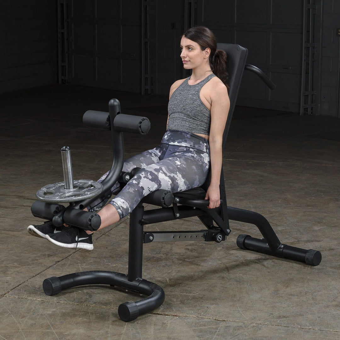 woman leg extension workout on Body-Solid Adjustable Weight Bench with Leg Extension & Leg Curl FID46