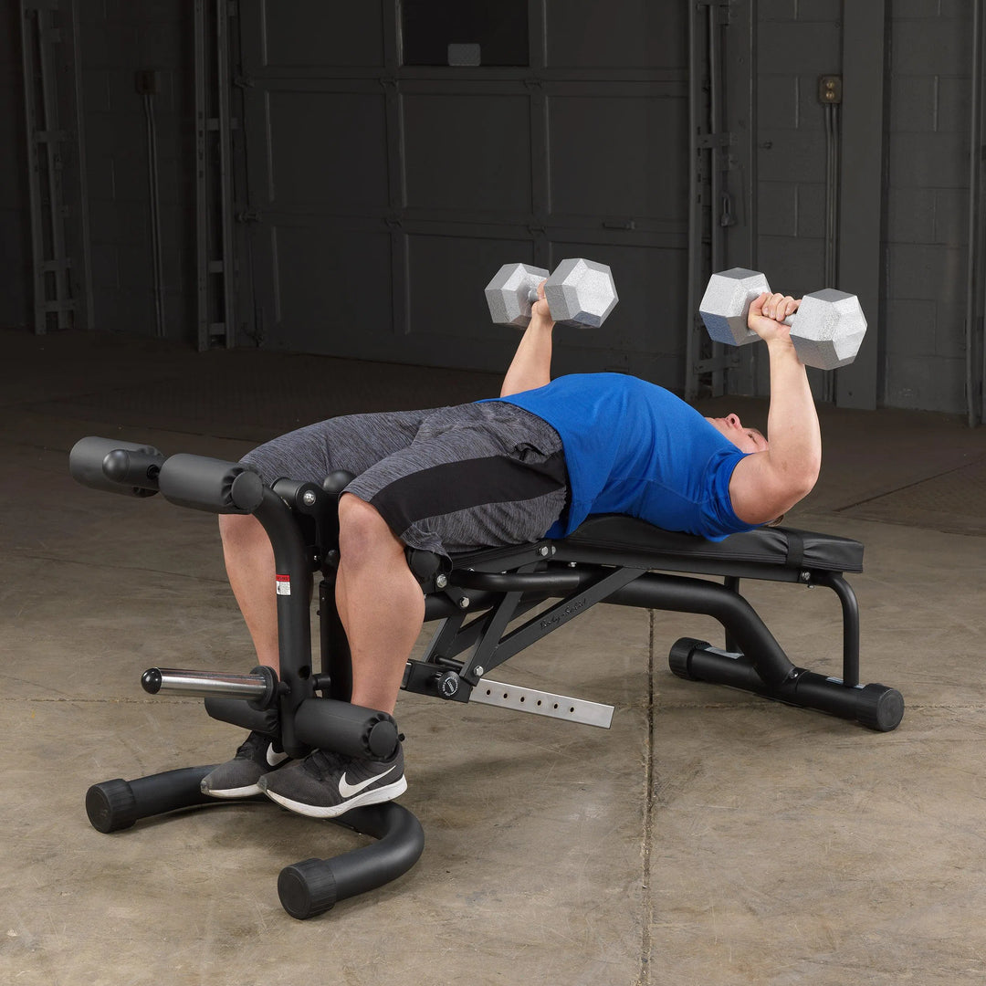 man dumbbell chest press exercise on Body-Solid Adjustable Weight Bench with Leg Extension & Leg Curl FID46