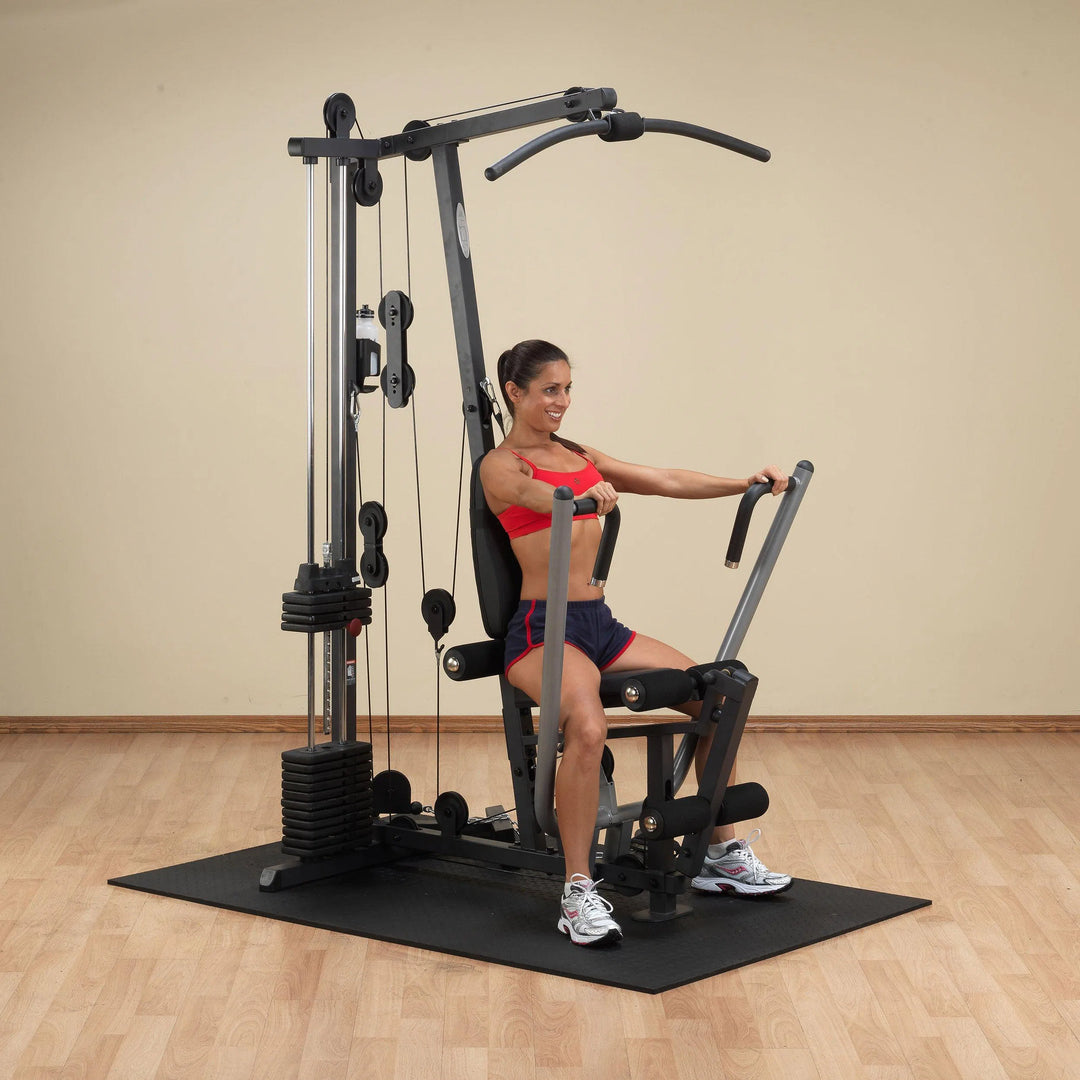 woman chest press exercise on Body-Solid Compact Home Gym G1S