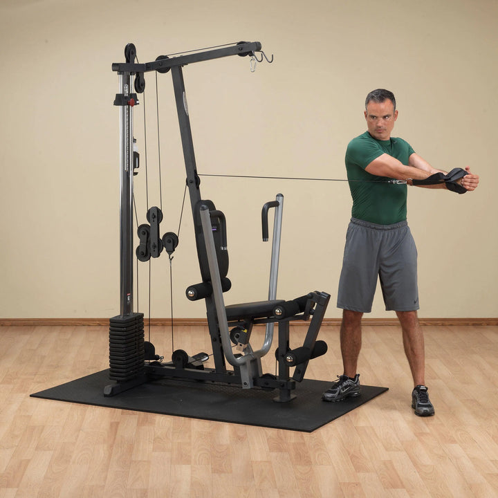 man cable twist exercise on Body-Solid Compact Home Gym G1S