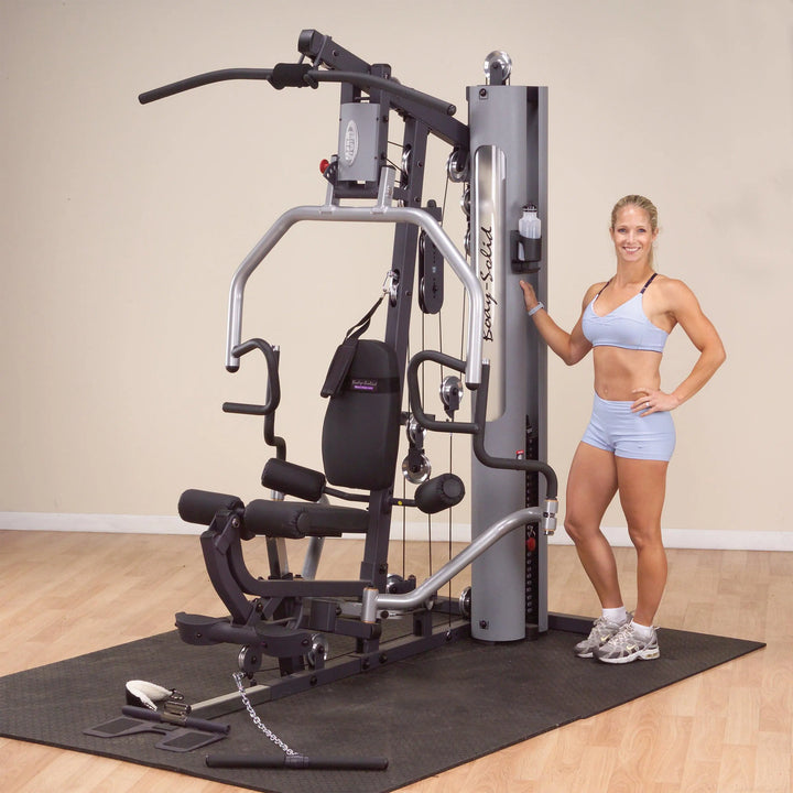 A woman showcasing the A woman training on the Body-Solid Compact Weight Machine G5S