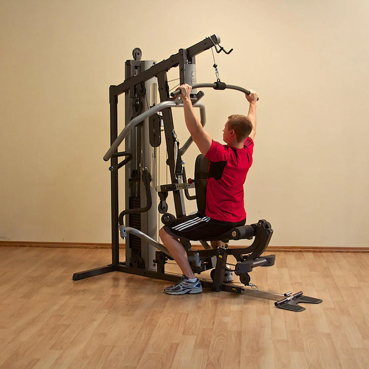 man back pull down exercise on Body-Solid Compact Weight Machine G5S