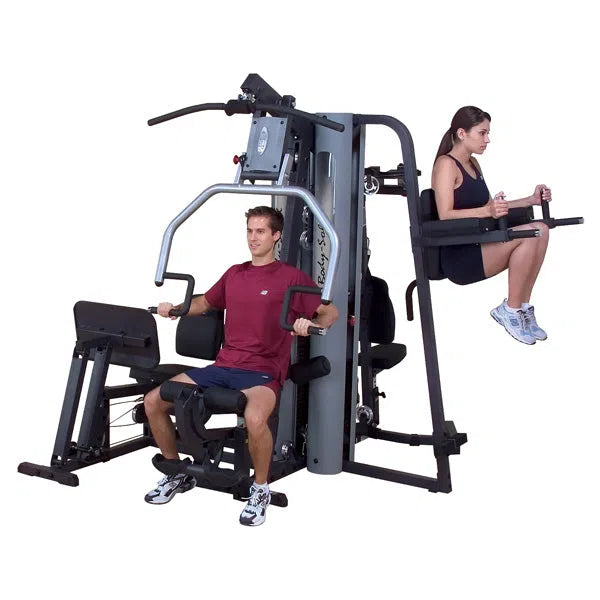 A couple training together on the Body-Solid Multi-Purpose Gym Machine G9S