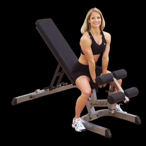A woman showcasing the Body-Solid Incline Decline Flat Weight Bench GFID71