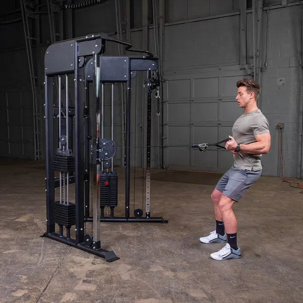 man standing cable row exercise on Body-Solid Functional Trainer Machine GFT100