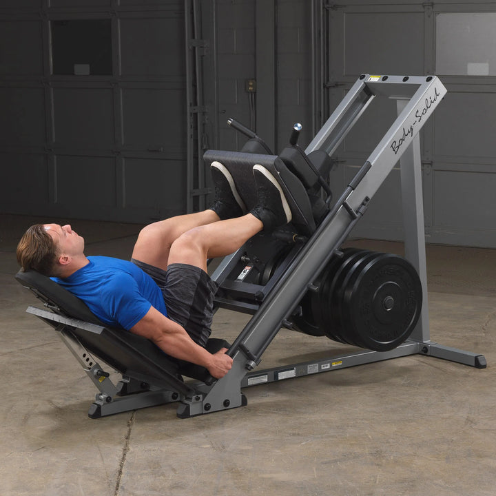 A man training his legs on the Body-Solid Leg Press Hack Squat Machine GLPH1100