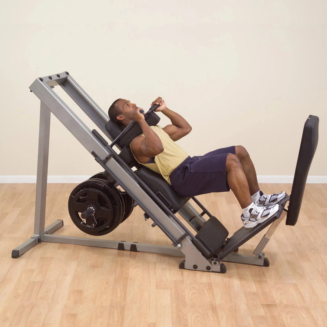 A man doing squat training on the Body-Solid Leg Press Hack Squat Machine GLPH1100