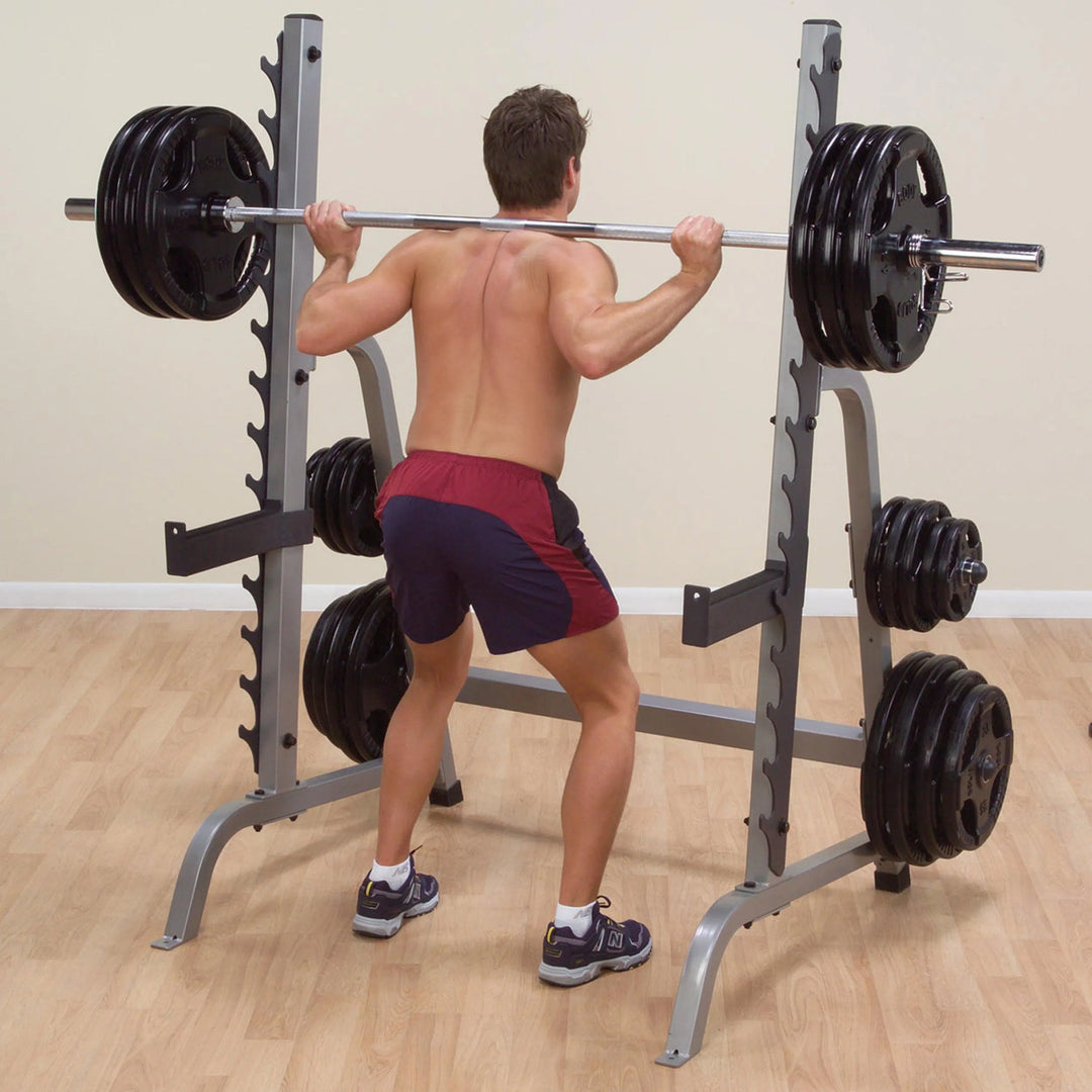 man doing back squats on the Body-Solid Squat and Bench Rack GPR370