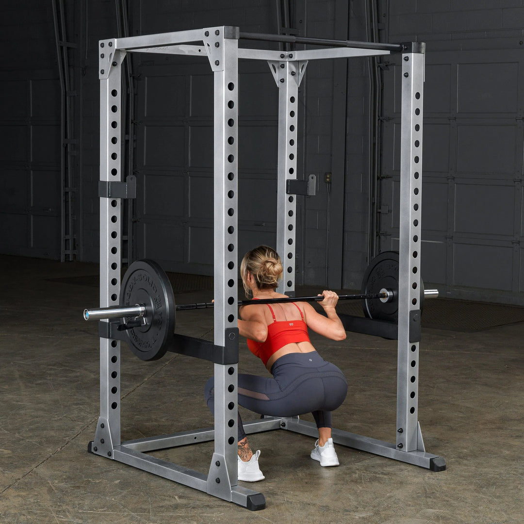 woman squat workout on Body-Solid Power Rack Set GPR378P4