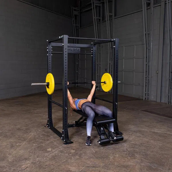 woman flat bench presses on Body-Solid Power Rack with Pulley System GPR400