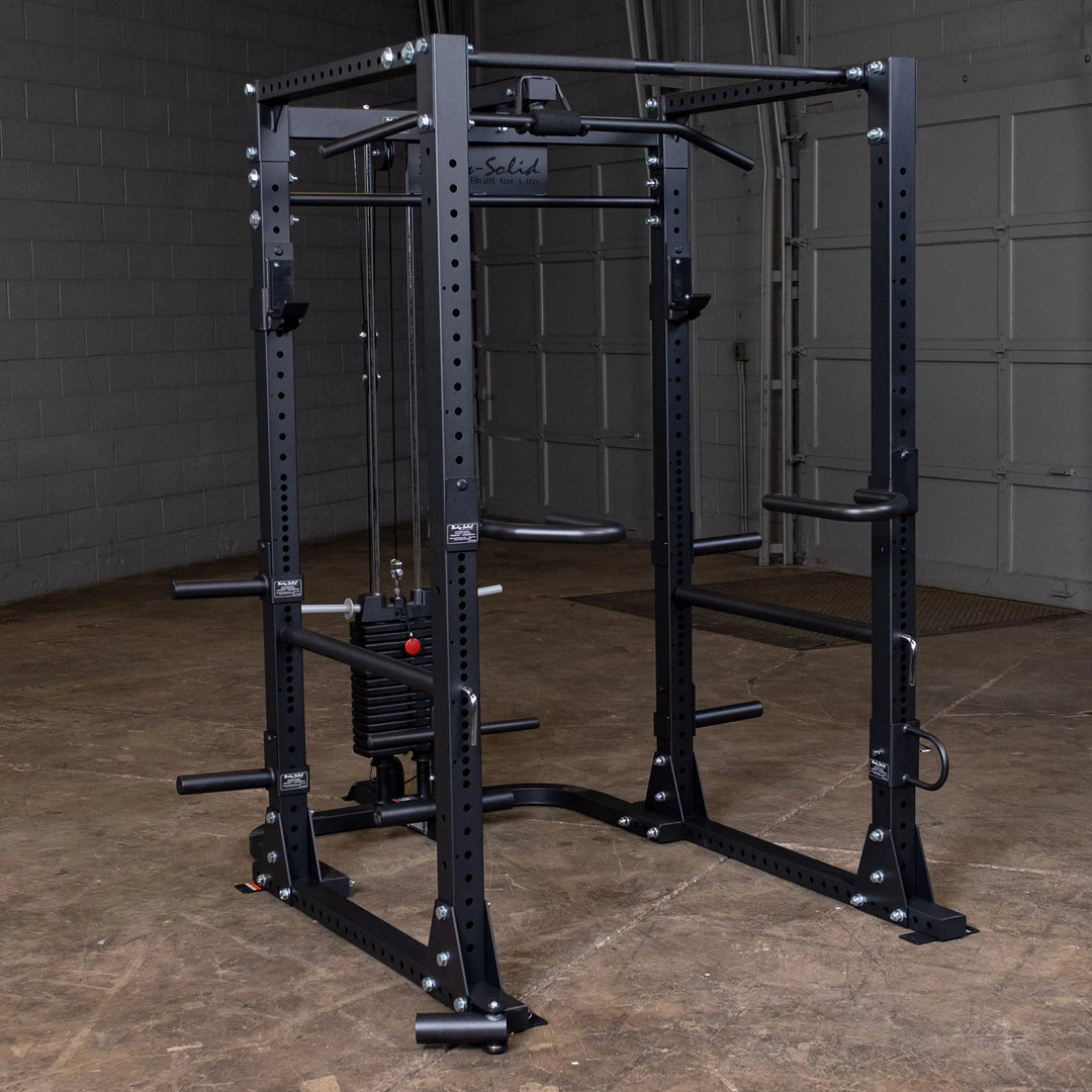 Body-Solid Power Rack with Pulley System GPR400 showcased with lat pulldown machine, bench press bar, and other attachments