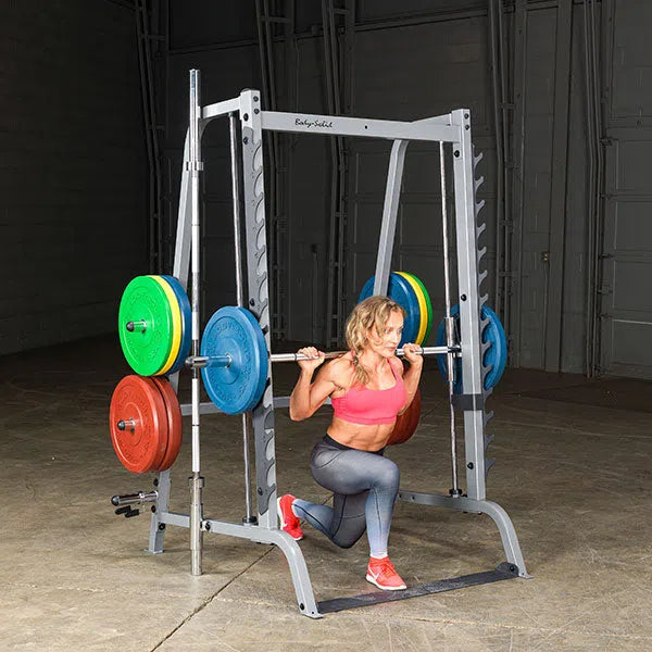 A woman doing split squats on the Body-Solid Series 7 Smith Press & Squat Machine GS348Q