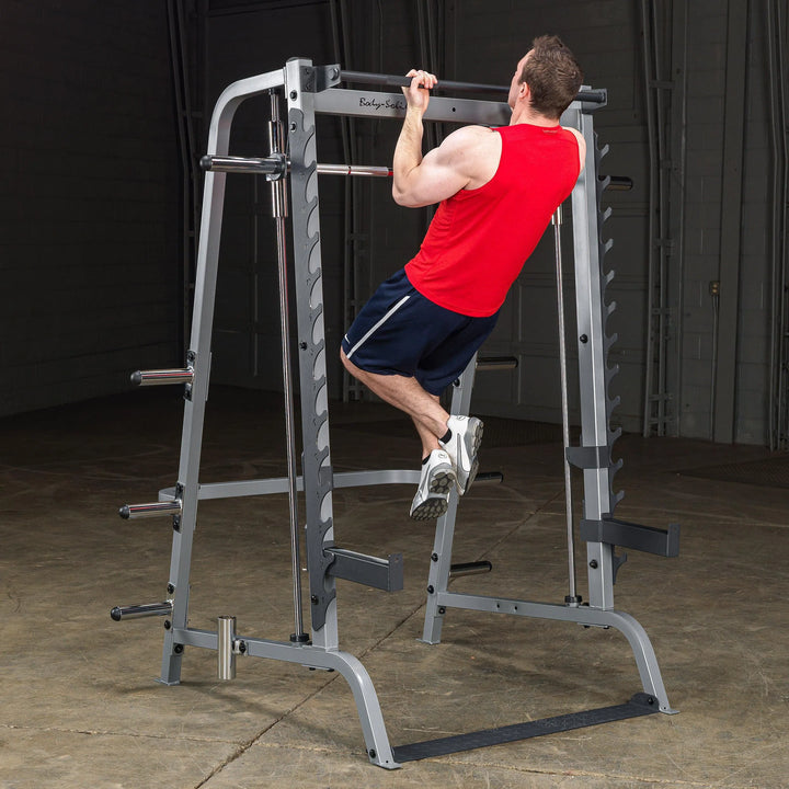 man chin up exercise on Body-Solid Series 7 Smith Press & Squat Machine GS348Q