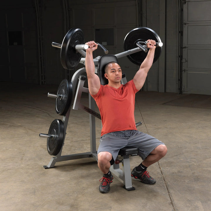 man shoulder press workout on Body-Solid Seated Shoulder Press Machine LVSP