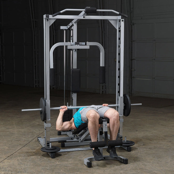 A man doing decline presses on the Body-Solid Powerline Home Smith Machine PSM1442XS