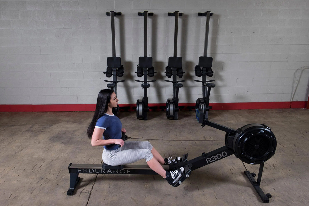 A woman training with a Body-Solid Endurance Commercial Rowing Machine R300