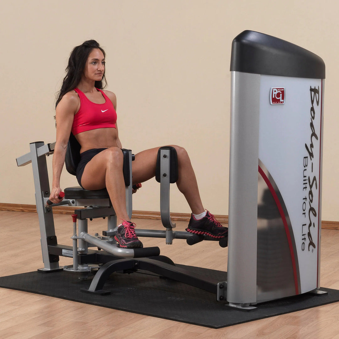 A woman training on the Body-Solid Hip Abduction Abductor Machine S2IOT