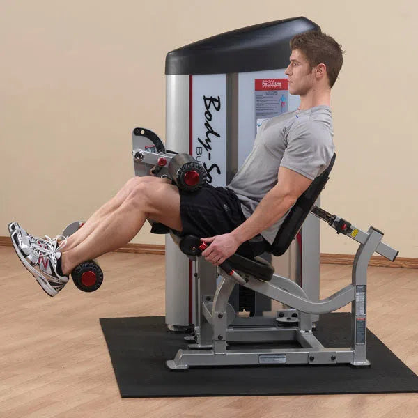 A man training on the Body-Solid Seated Leg Curl Machine S2SLC