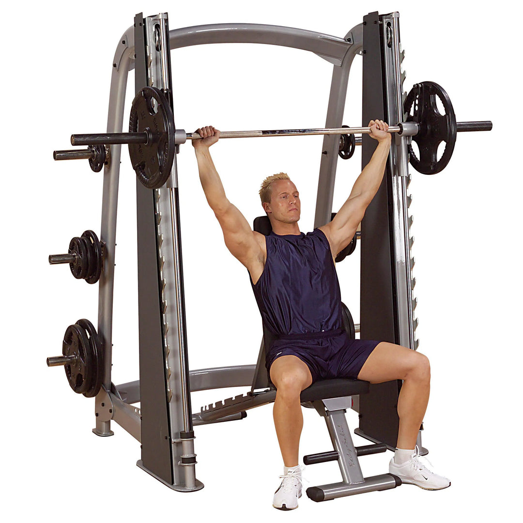 A man doing incline bench presses on the Body-Solid Commercial Smith Machine SCB1000