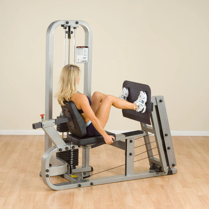 A woman training on the Body-Solid Leg Press Machine SLP500G