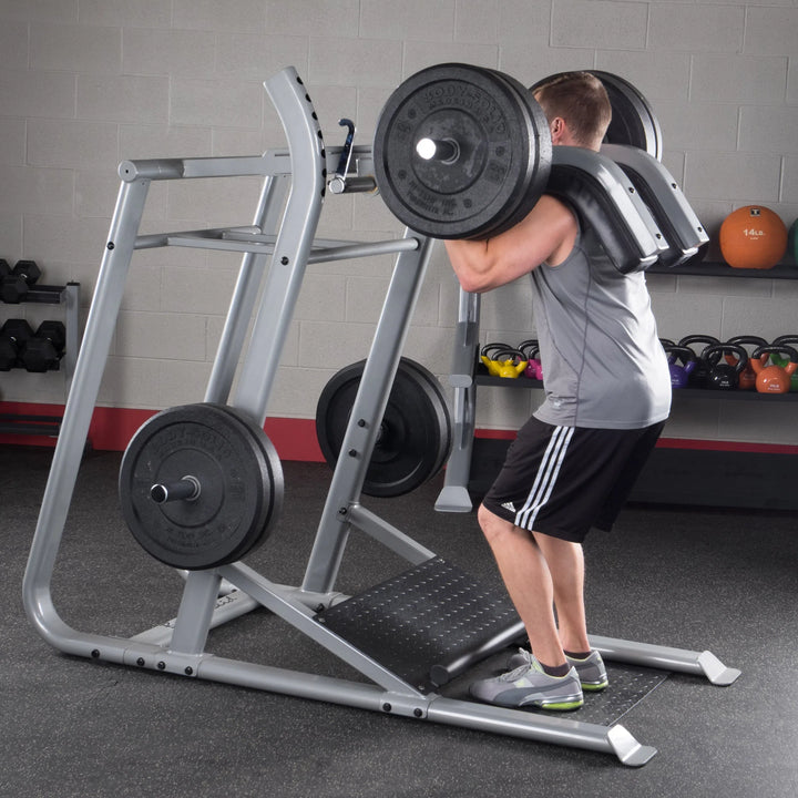 A man doing squats on the Body-Solid Leverage Squat Machine SLS500