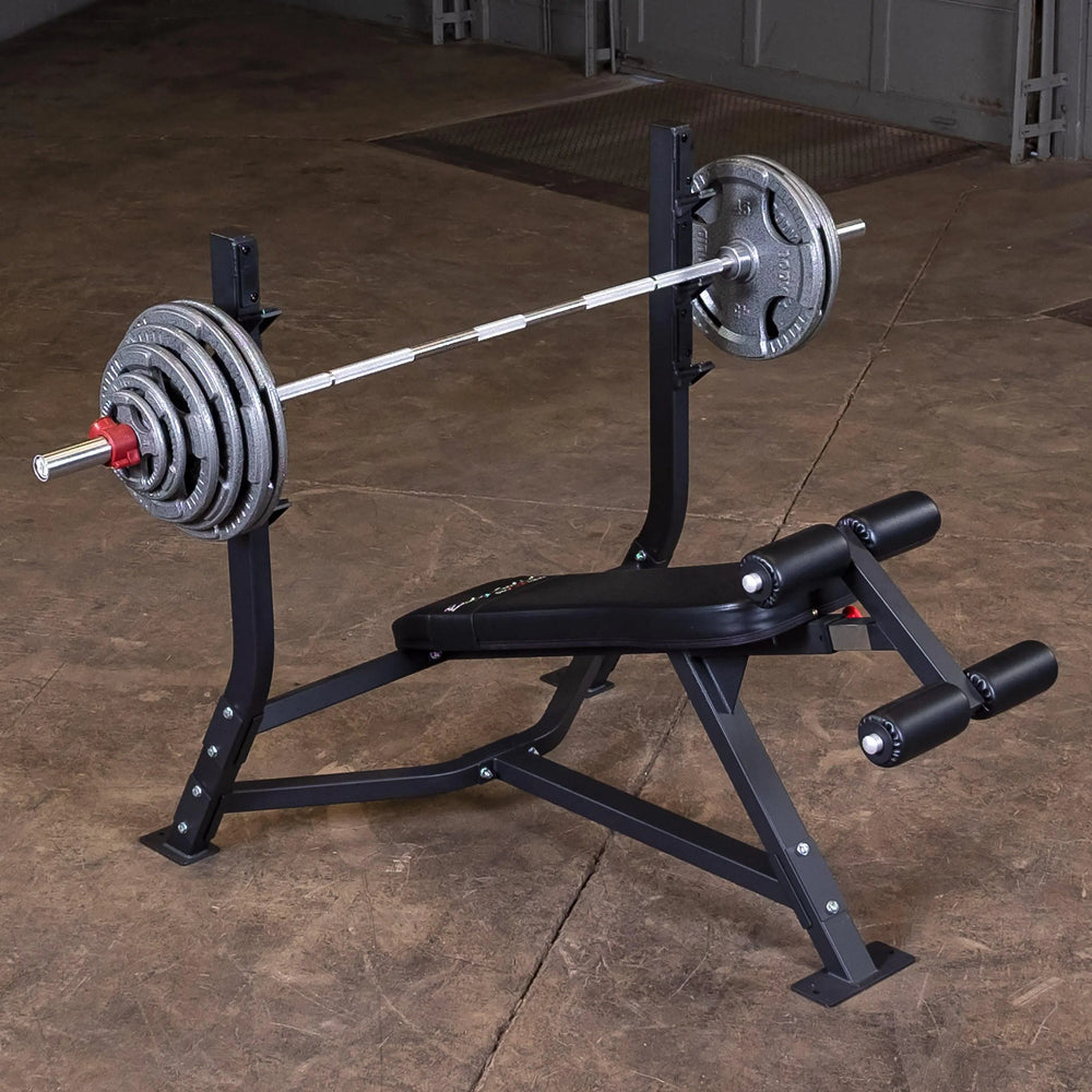 Body-Solid Commercial Olympic Decline Bench SODB250 on display with barbell