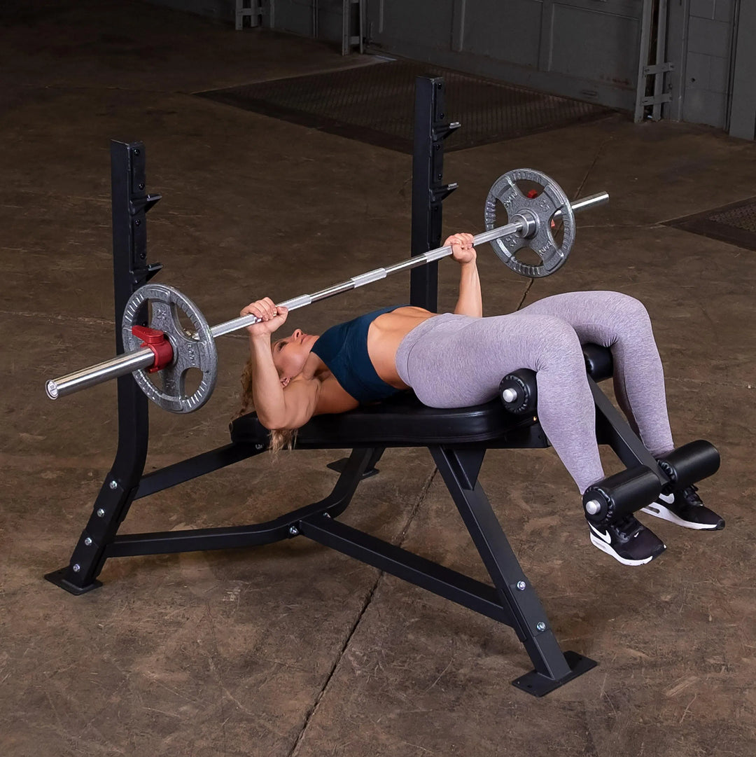 woman decline barbell bench press workout on Body-Solid Commercial Olympic Decline Bench SODB250