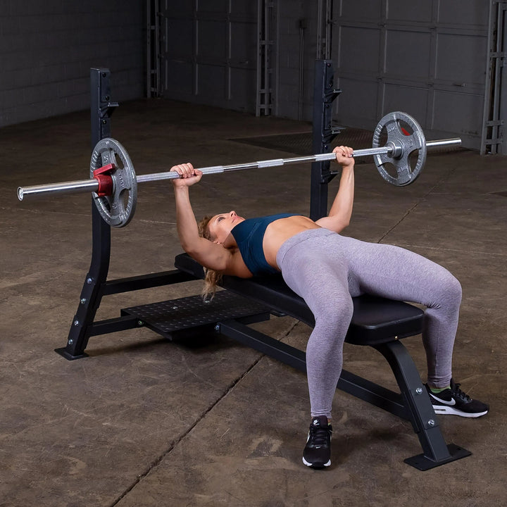 woman barbell bench press workout on Body-Solid Commercial Olympic Flat Bench SOFB250