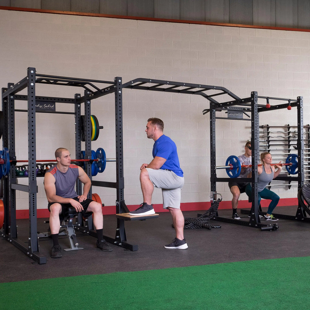 A group of four training together on the Body-Solid Double Power Rack SPR1000DB