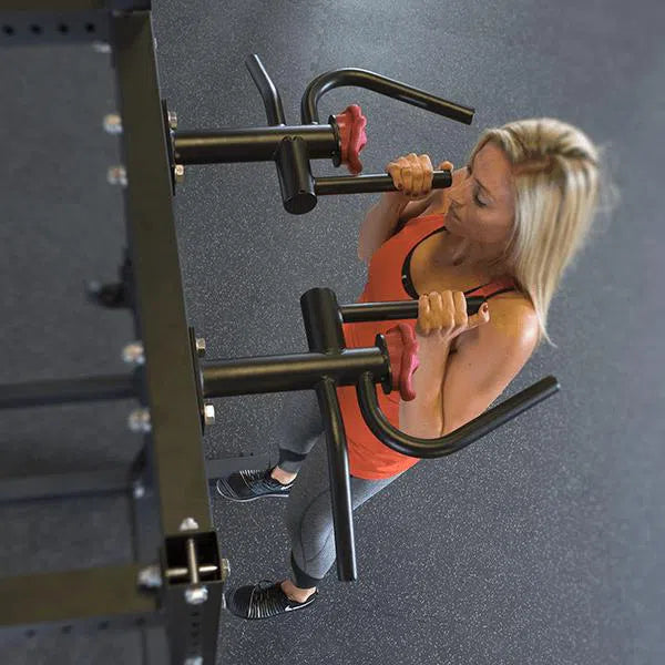 woman doing pull-ups on the Body-Solid Commercial Power Rack SPR1000