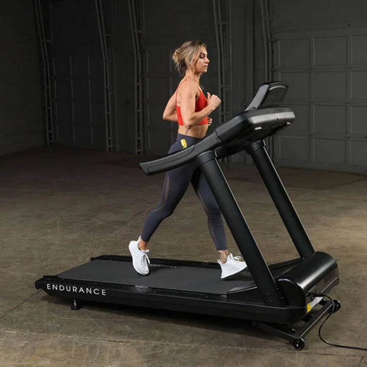 fit girl running on Body-Solid Endurance Commercial Grade Treadmill T150