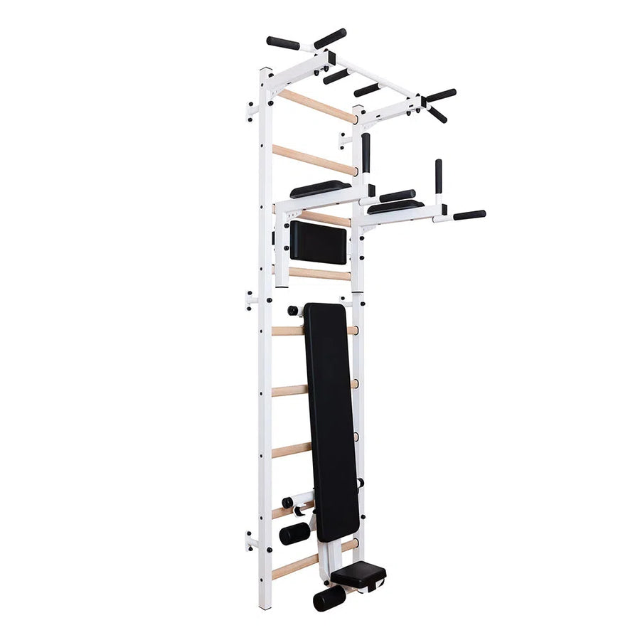 The BenchK Pro Gym Swedish Ladder w/ Bench, Dip & Pull-Up Bar (723) by BenchK is a multifunctional wall-mounted exercise station featuring a Swedish Ladder, foldable bench, pull-up bars, dip handles with a white frame, light wooden rungs, and black padding for various bodyweight exercises.