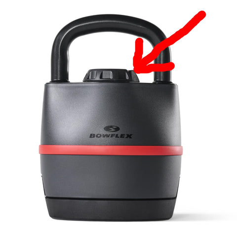 Bowflex kettlebell with a red arrow pointing to a specific part on a white background