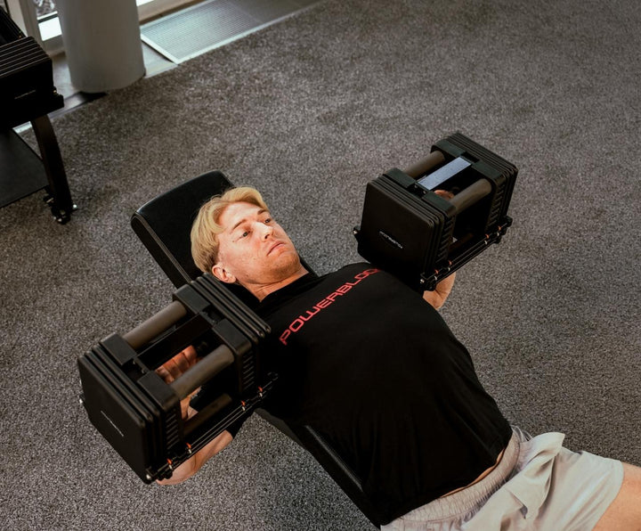 PowerBlock Commercial Pro 175 adjustable dumbbell in a commercial gym setting