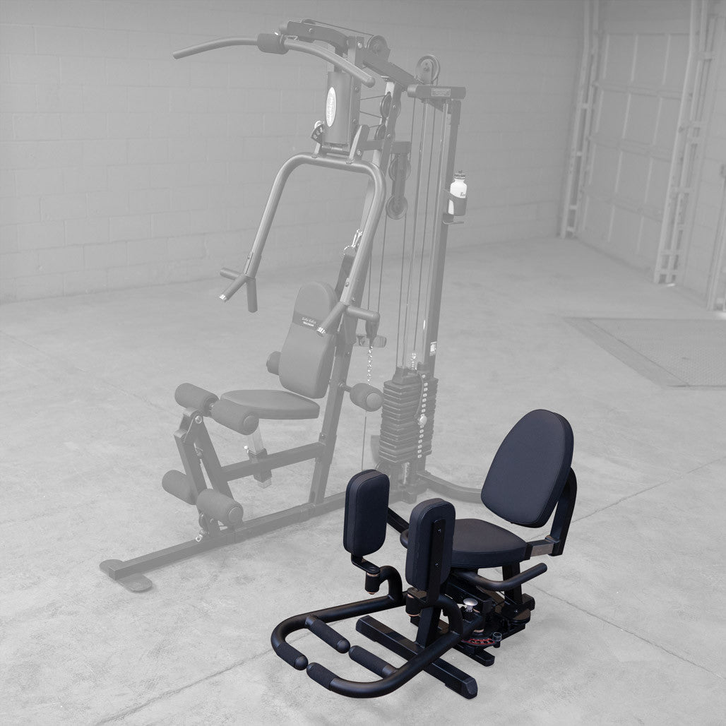 Full view of a Body-Solid G Series home gym with the GIOT inner and outer thigh attachment installed