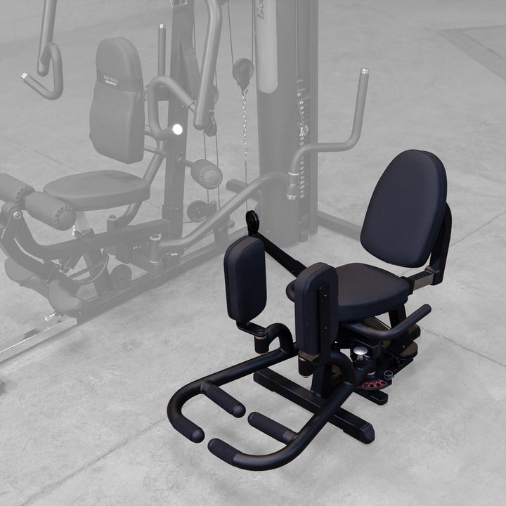 Body-Solid GIOT attachment on a G Series gym, showing the seat and lumbar supported back pad